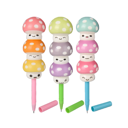 Set of three colorful mushroom-shaped pens with smiley faces on a white background