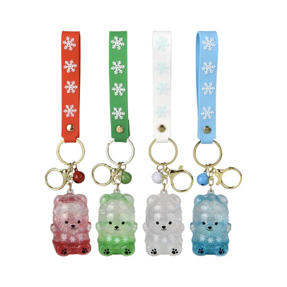 Four bear-shaped keychains with colorful straps and snowflake designs on a white background.